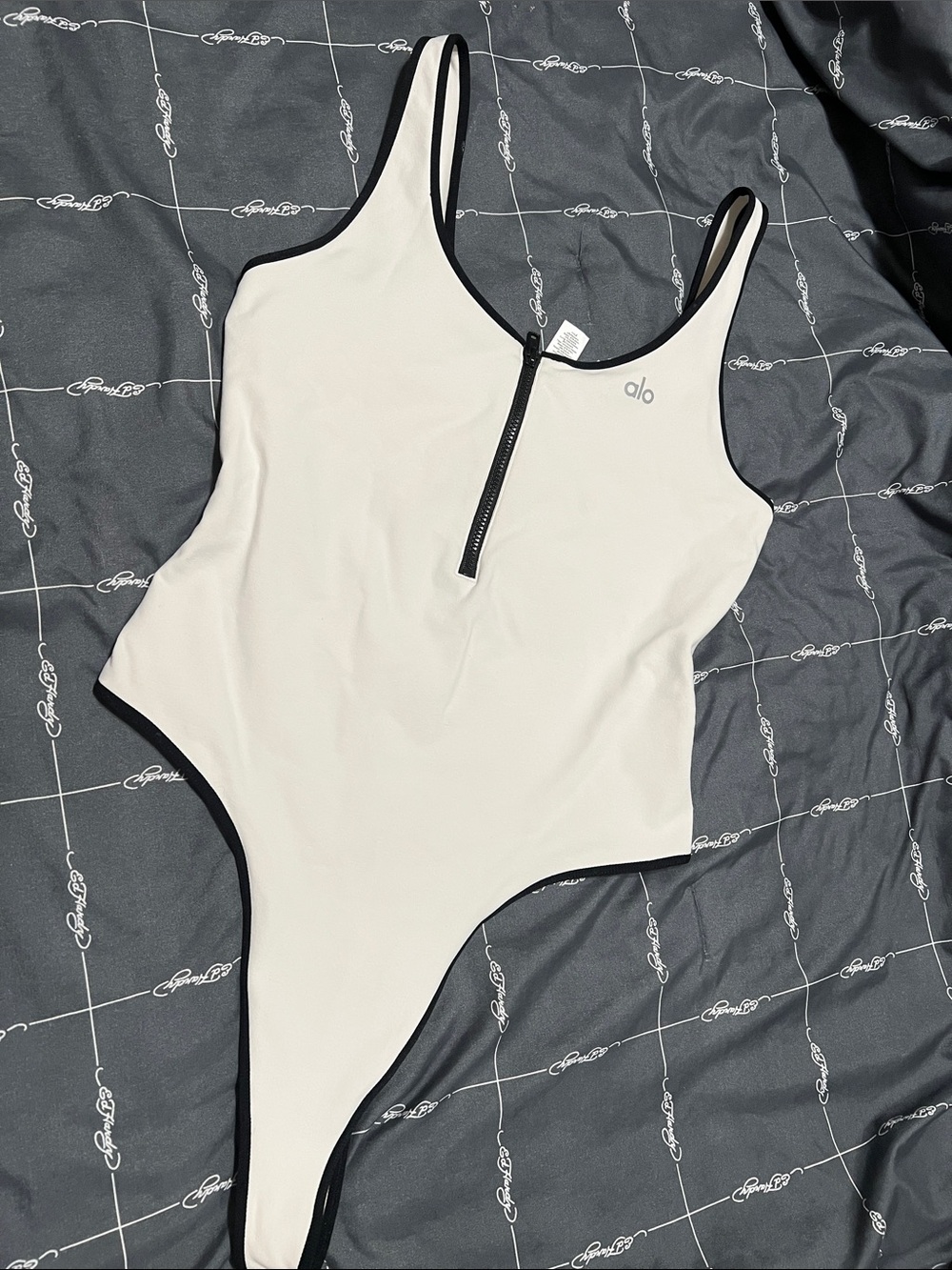 ALO Yoga Cream One-Piece Swimsuit with Black Trim and Front Zip
